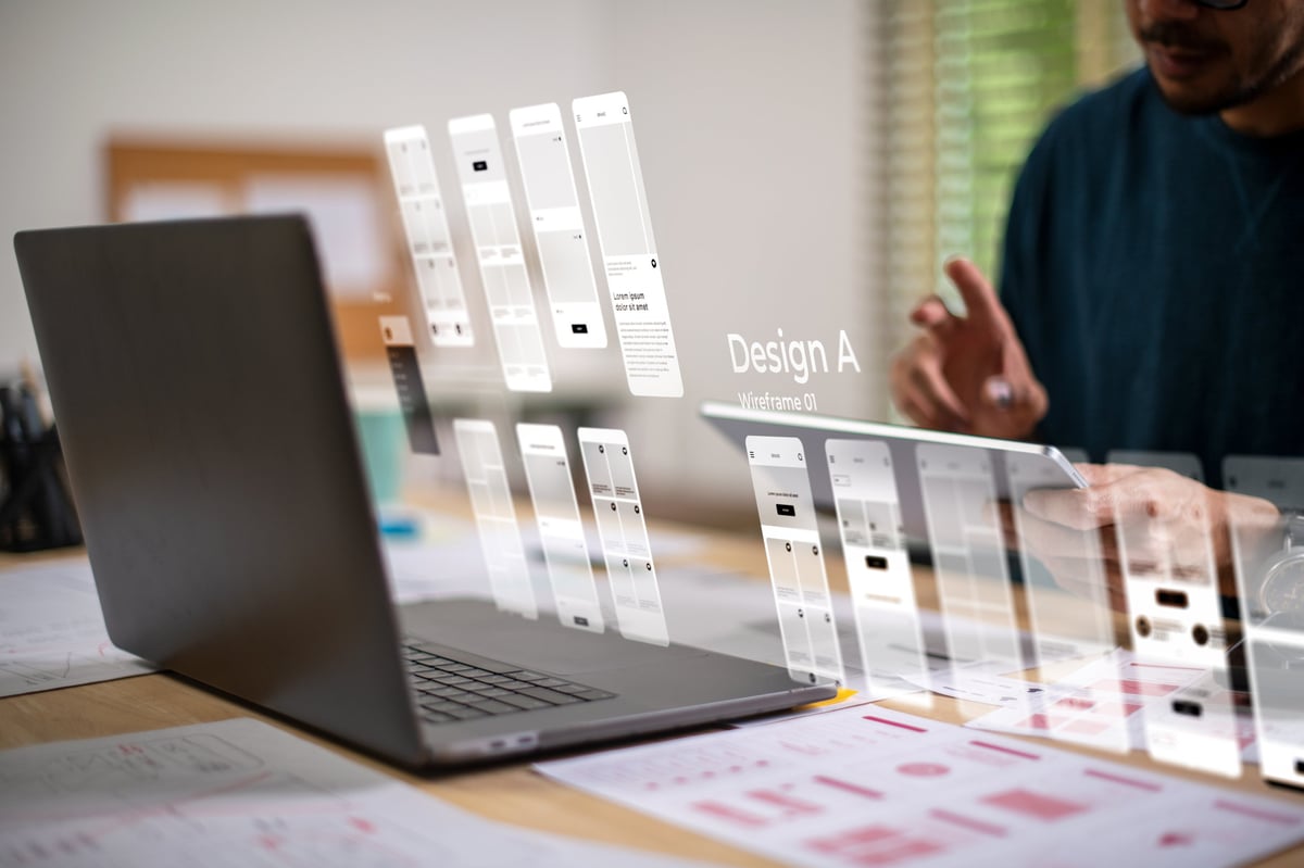 Designer building a website prototype with an interactive interface in front of them